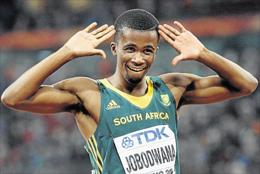 Anaso Jobodwana celebrates after winning the bronze medal in the men's 200m final during the Beijing 2015 IAAF World Championships