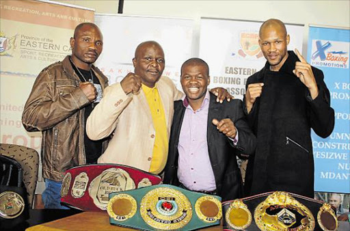BELT IT TO THEM: Komani FIGHT fans will be treated to top-class action where, from left, Balimo Weliya, former Komani boxer Solomon Manzi, trainer Dudu Bungu and WBO welterweight champion Ali Funeka hit town Picture: BHONGO JACOB