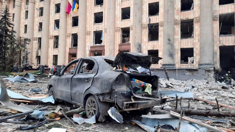 A burnt car outside the regional administration building that was hit by a missile, according to city officials, in Kharkiv, Ukraine, March 1 2022. Picture: STATE EMERGENCY SERVICE/REUTERS