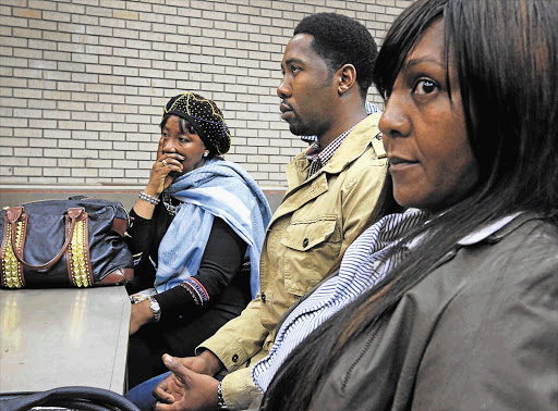 Nelson's Mandela's daughter Makaziwe and grandchildren Ndaba and Ndileka in the Mthatha High Court yesterday where they and other family are waging a battle against grandson Mandla