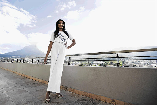 Miss USA, Nana Meriwether, on the balcony of her 20th-floor penthouse in Cape Town. Meriwether, whose grandparents live in Soweto, is in South Africa for a few days of charity work