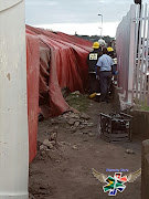 Paramedics are scrambling to save a cyclist trapped beneath hundreds of kilograms of timber in Durban. Picture Credit: Supplied