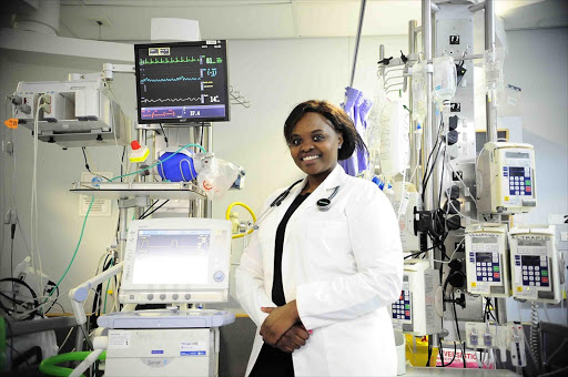 Dr Ncumisa Jilata checking a patient's machine. She is the youngest neurosurgeon in Africa. Pic Thulani Mbele © Sowetan.