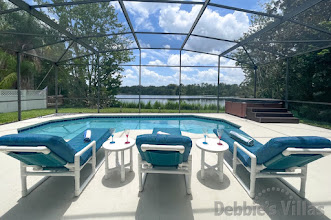 Enjoy the lake view from the pool deck of this Kissimmee vacation villa