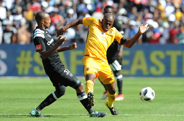 Willard Katsande of Kaizer Chiefs in action with Xola Mlambo of Orlando Pirates during the Absa Premiership match between Orlando Pirates and Kaizer Chiefs at FNB Stadium on March 03, 2018 in Johannesburg, South Africa.