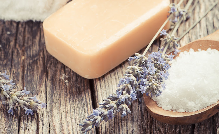 A fragrant bar of bath soap and some coarse salt are all you'll need to mix up your bath salts at home.