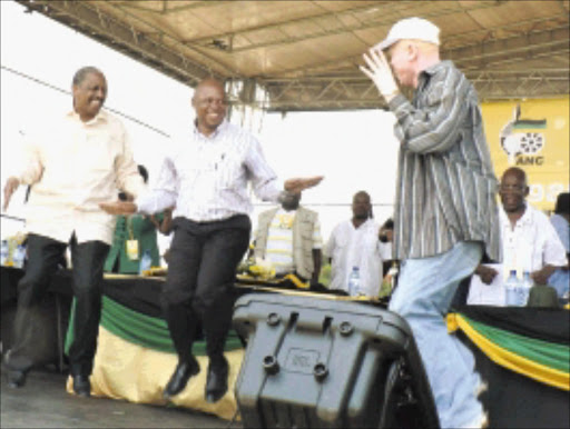 CELEBRATION: ANC treasurer general Mathew Phosa and Premier Cassel Mathale join Rapson Rambuwani to dance to his song that praises the ANC in Musina on Saturday. 16/01/2010. © Unknown.