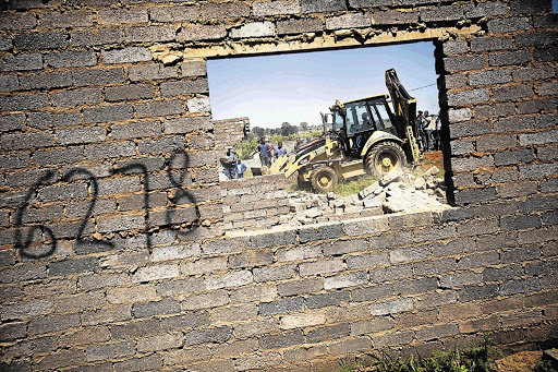 More than 50 houses in Lenasia have been demolished by the provincial government after con artists sold plots to would-be home owners with false deeds of sale