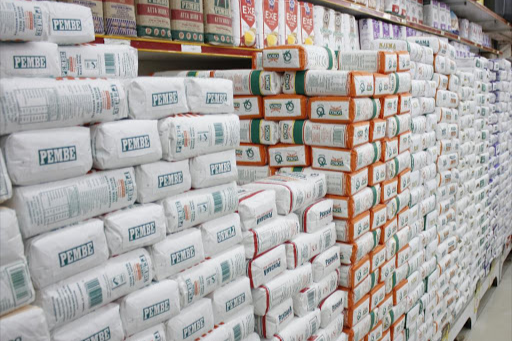 Packets of maize flour in a Supermarket shelf.