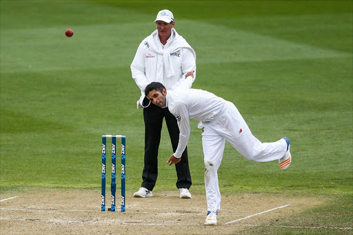 Keshav Maharaj of South Africa bowls during day three of the test match between New Zealand and South Africa at Basin Reserve on March 18, 2017 in Wellington, New Zealand. Hagen Hopkins/Getty Images