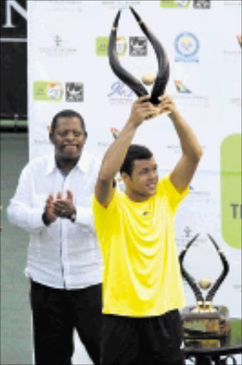 TENNIS KING: Jo-Wilfriend Tsonga of France with the trophy he won during the SA Tennis Open Singles Final against South African Jeremy Chardy which was played at Montecasino in Johannesburg. 08/02/09. Pic. Lee Warren. © Gallo Images.