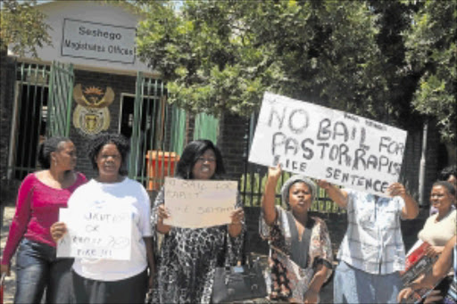 ANGRY: Protesters with placards opposing the bail application of Pastor James Thobakgale of the Deliverance Church of Christ in Seshego Zone 5 for allegedly raping a 14-year-old girl. PHOTO: ELIJAR MUSHIANA