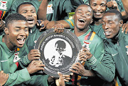 JOYOUS WINNERS: Zambia captain Chris Katongo, second from left, celebrates with his teammates after their win against Bafana Bafana in the Nelson Mandela Challenge when they defeated SA 1-0 at the FNB Stadium on Wednesday night Picture: REUTERS