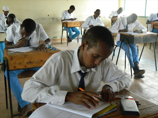 Form four candidates of Garissa High School sit for their KCSE mathematics paper. /STEPHEN ASTARIKO