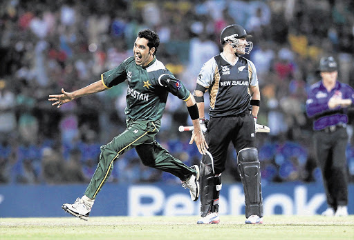 Pakistan's fast-medium bowler Umar Gul, left, celebrates taking the wicket of New Zealand's Brendon McCullum during their Twenty20 World Cup match in September. He is central to Pakistan's attack