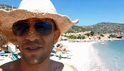 Adam Catzavelos filmed himself on a beach in Greece, celebrating the fact that there were no black people there. 