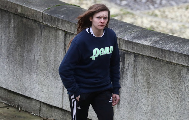 Gemma Watts, a British woman who pledged guilty for posing as a teenage boy to sexually groom young girls, walks to the Winchester Crown Court in Winchester, Britain, January 10, 2020.