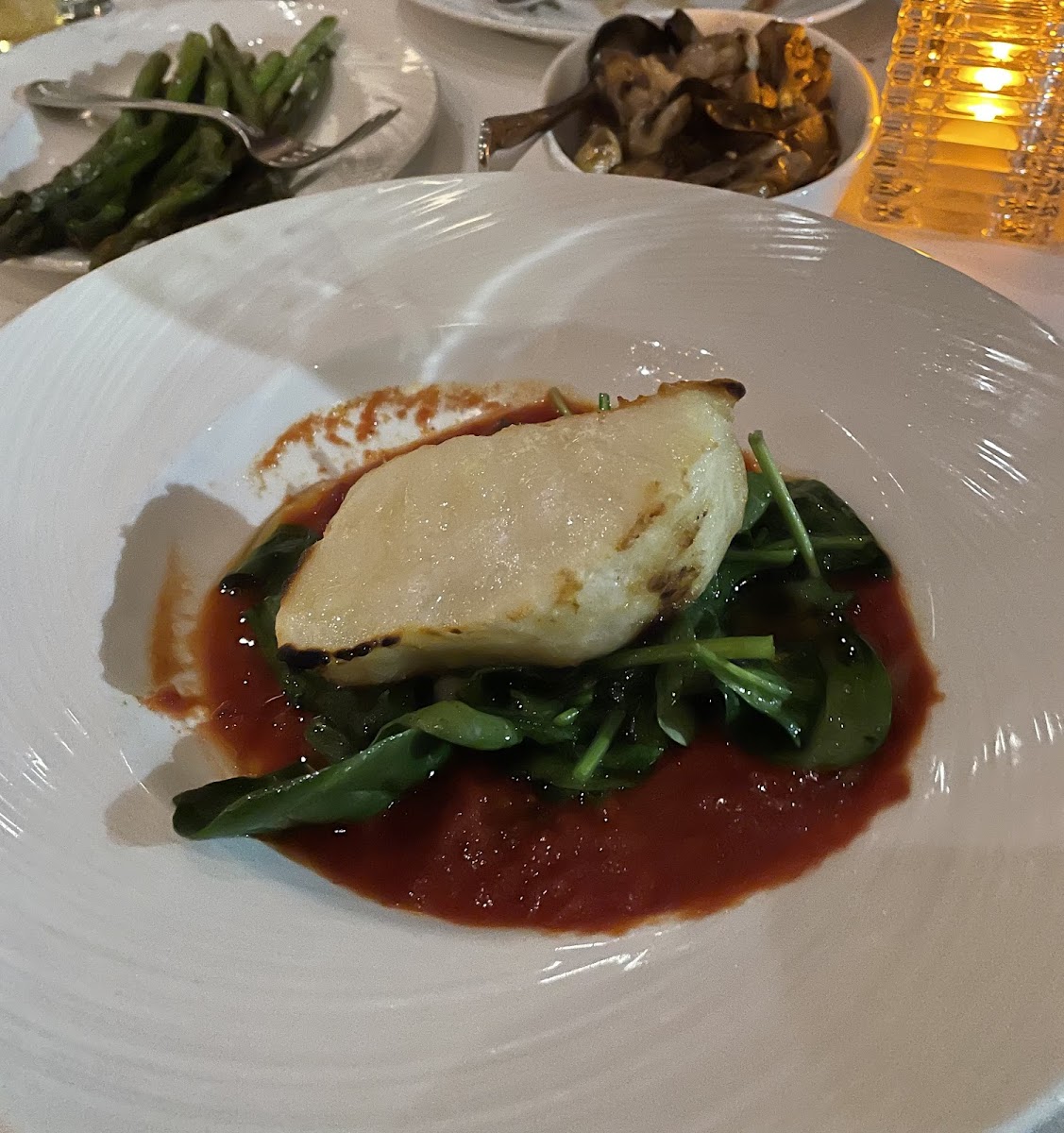 Chilean Sea Bass with tomato sauce and vegetables