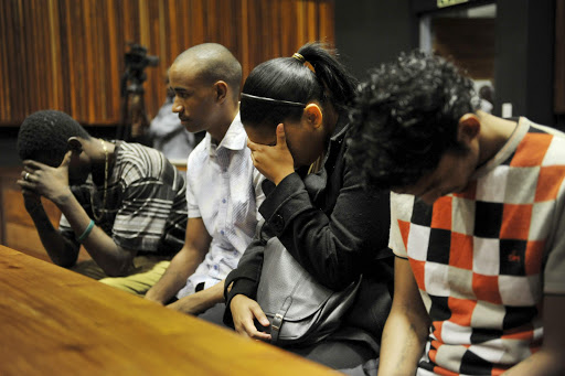 Harvey Isha, Robin Harwood, Lindon Wagner, and Courtney Daniels at the Palm Ridge Magistrate's Court on April 17, 2013, in Johannesburg. File photo.