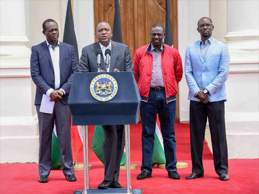 JP secretary general Raphael Tuju, President Uhuru Kenyatta and DP William Ruto address the media at State House, Nairobi, on Saturday /PSCU