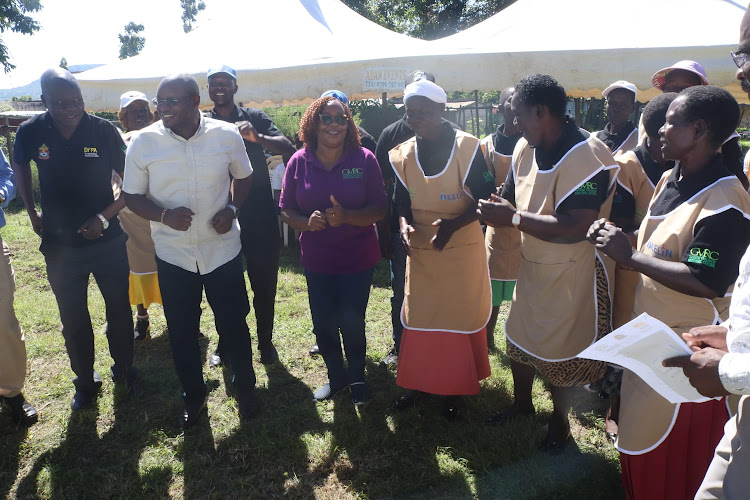 County Health Chief Officer Kevin Osuri and his counterpart from Gender Dolphin Ochere with GVRC manager in charge of Medical and psy-chosocial support services Rebecca Gitau and CHPs at Mbita hospital in Homa Bay