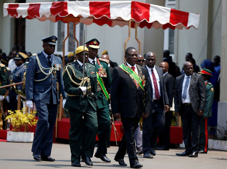 Zimbabwe's President Emmerson Mnangagwa arrives to officially open a new parliament session as well as deliver his state of the nation address at Parliament Building in Harare, Zimbabwe, on October 1 2019.