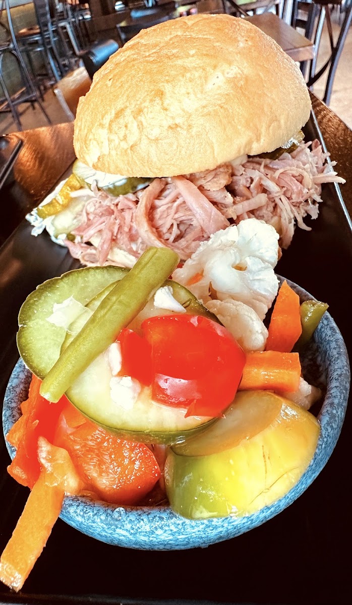 Pulled ham sandwich on a gf bun with a double side of pickled veggies!