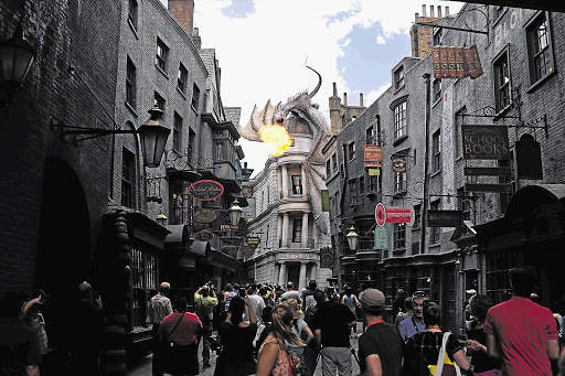 15 MINUTES OF FLAME: A dragon breathes fire above The Wizarding World of Harry Potter: Diagon Alley at the Universal Orlando Resort in Orlando, Florida Picture: REUTERS