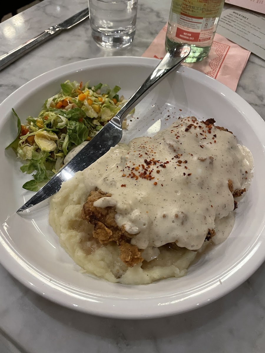 Seasonal buson chicken fried steak and mashed potatoes with brussel sprout slaw