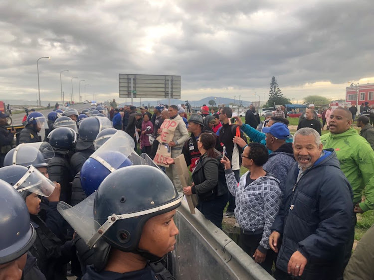 Riot police confront Bishop Lavis residents who blockaded the suburb on Wednesday September 12 in a protest against violence.