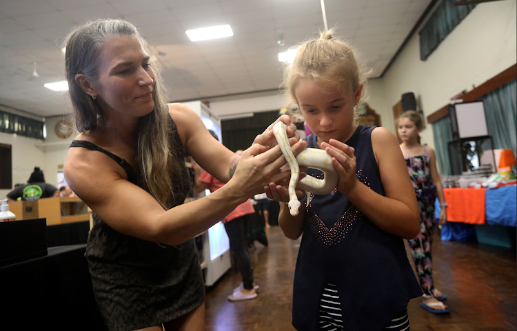 Zandrie Pretorius holding the world's first "moth" ball python at the Durban Reptile Expo in Pinetown.