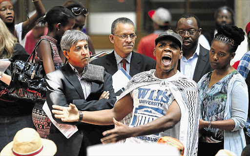 WE WANT THE MONEY! Wits University Vice-chancellor Adam Habib, middle, watches as the Student Representative Council protests the university's demand that poor students pay a registration fee of R4670
