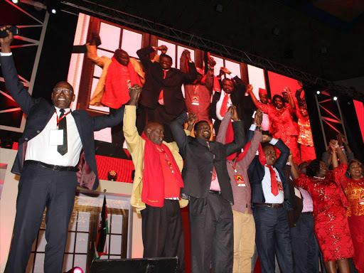 MPs who defected from the opposition to the Jubilee Party during a delegates’ meeting on September 9 at the Safaricom Stadium Kasarani /COLLINS KWEYU