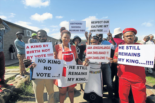 OUTCRY: Supporters of jailed King Buyelekhaya Dalindyebo hold posters after the abaThembu meeting at which it was resolved to appoint his son, Prince Azenathi Zanelizwe Dalindyebo, as acting king Picture:LULAMILE FENI