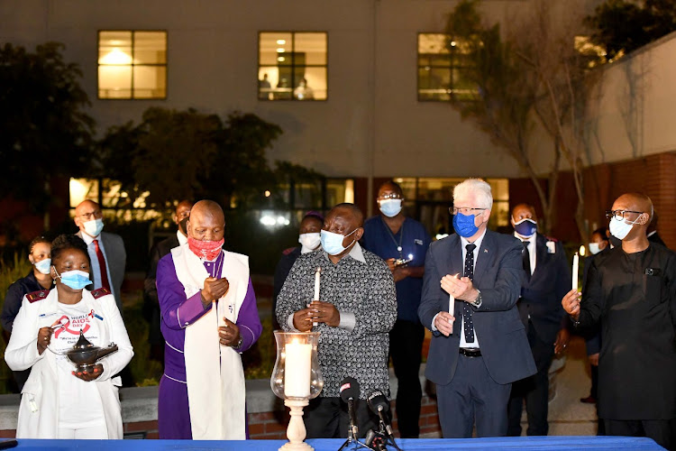 President Ramaphosa joined by Western Cape premier Alan Winde, religious leaders and health care workers during a candle lighting ceremony at Khayelitsha District Hospital on New Year's Eve.