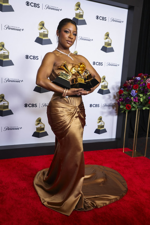 Victoria Monet poses with the Best R&B Album and Best New Artist award.