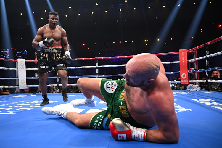 Francis Ngannou floors Tyson Fury during their fight on Saturday.