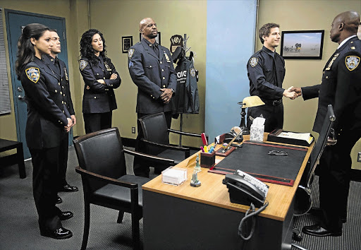 GOOD GUYS: Andy Samberg, second right, plays quintessential wise-guy detective Jake Peralta in Golden Globe winner 'Brooklyn Nine-Nine'
