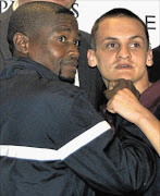 READY TO OFF-LOAD: IBO strawweight champion Hekkie 'Hexecutioner' Budler and Nkosinathi 'Mabere' Joyi pose for cameras during their recent press briefing for their shootout at Emperors Palace on June 15
      PHOTO: Jeff Ellis