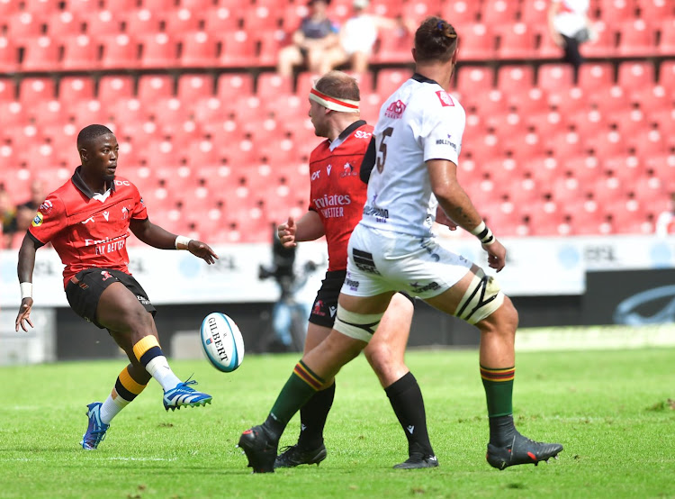 Sanele Nohamba of the Lions teases the Sharks defence with a deft kick at Ellis Park in their URC match.