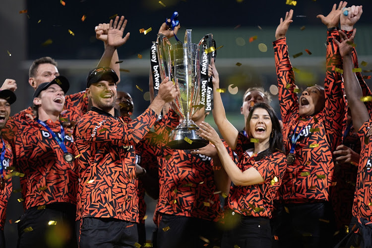 Sunrisers Eastern Cape captain Aiden Markram and franchise owner Kavya Maran lift the SA20 trophy as they celebrate with the team on Saturday at Newlands in Cape Town after their win in the final against Durban's Super Giants.