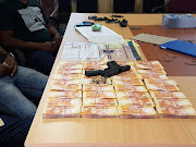 The money, firearm and ammunition recovered by police after being stolen from a house in Eshowe, KwaZulu-Natal.