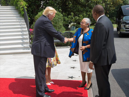 First Lady Margaret Kenyatta greets US President Donald Trump at the White House, Washington on Monday. Looking on is President Uhuru Kenyatta and US First Lady Melania Trump (partially hidden), August 27, 2018. /PSCU