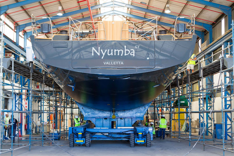 Nyumba GT is prepared to be transported to the docks in Cape Town to be placed in the water.