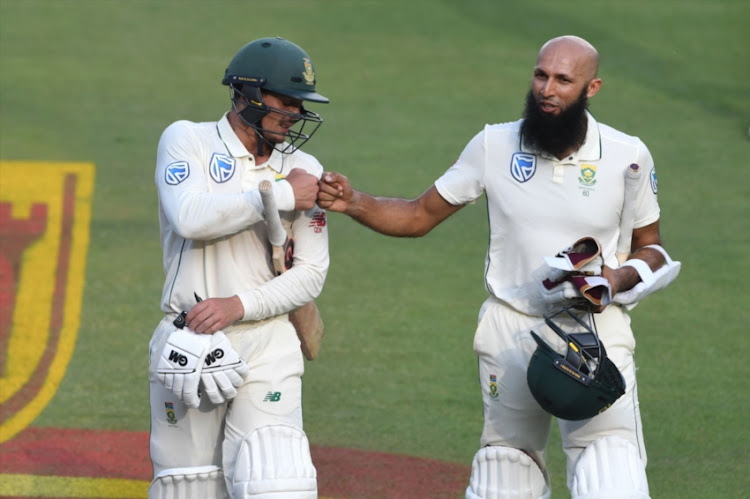 Quinton de Kock and Hashim Amla of the Proteas during day 2 of the 3rd Castle Lager Test match between South Africa and Pakistan at Bidvest Wanderers Stadium on January 12, 2018 in Johannesburg, South Africa.