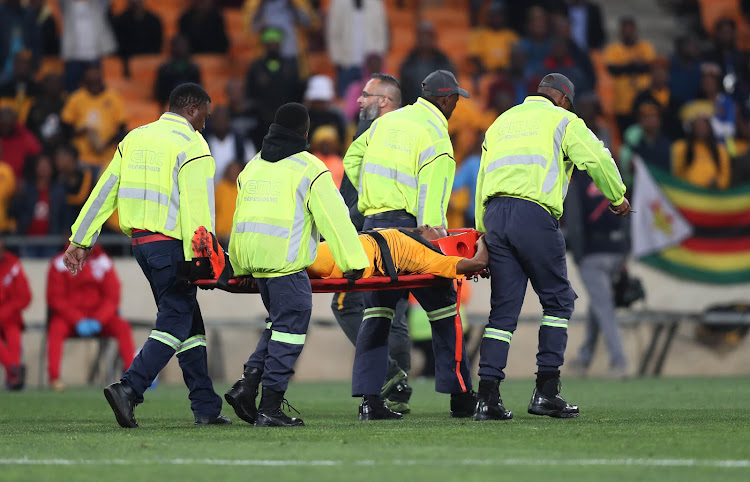 Kaizer Chiefs attacking midfielder Joseph Molangoane is stretchered off after sustaining horrific injury during the MTN8 quarterfinal match Free State Stars at FNB Stadium on August 11 2018.