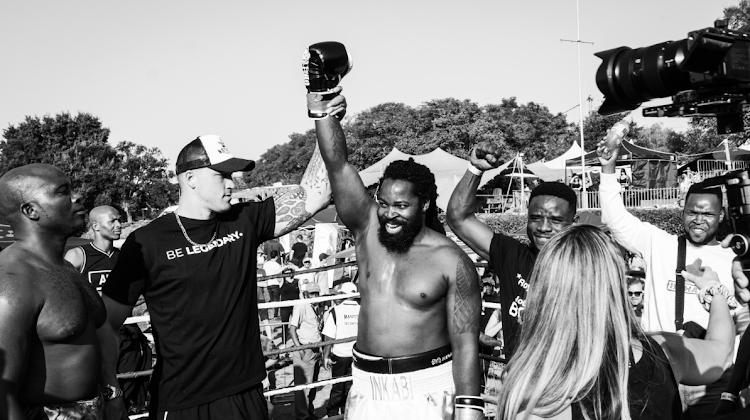 Big Zulu celebrates victory, after winning by technical knockout.