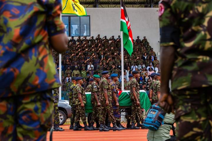 Military officers carry the casket the bearing the remains of late Francis Ogolla during the memorial service at Ulinzi sports complex on April 21, 2024.