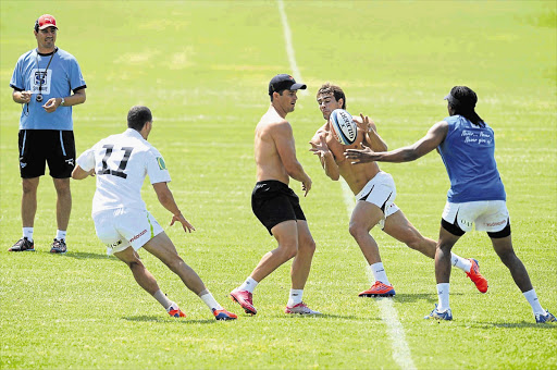 Bulls players Bjorn Basson, Morne Steyn, JJ Engelbrecht and Akona Ndungane train at Loftus in yesterday ahead of their clash with the Cheetahs on Saturday Picture: LEE WARREN/GALLO IMAGES