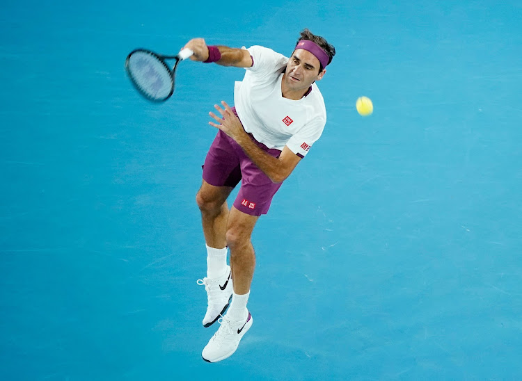 Switzerland's Roger Federer serves during his match against Hungary's Marton Fucsovics.